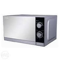 Sharp 20 Liter 800 Watts Black Finished Door Microwave Oven with Defrost Function Size (L x W x H) 45 x 25 x 35 cm R-20CT(S) Silver 1 year warranty.